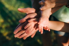 Happy beautiful family on the big garden on the dawn time.